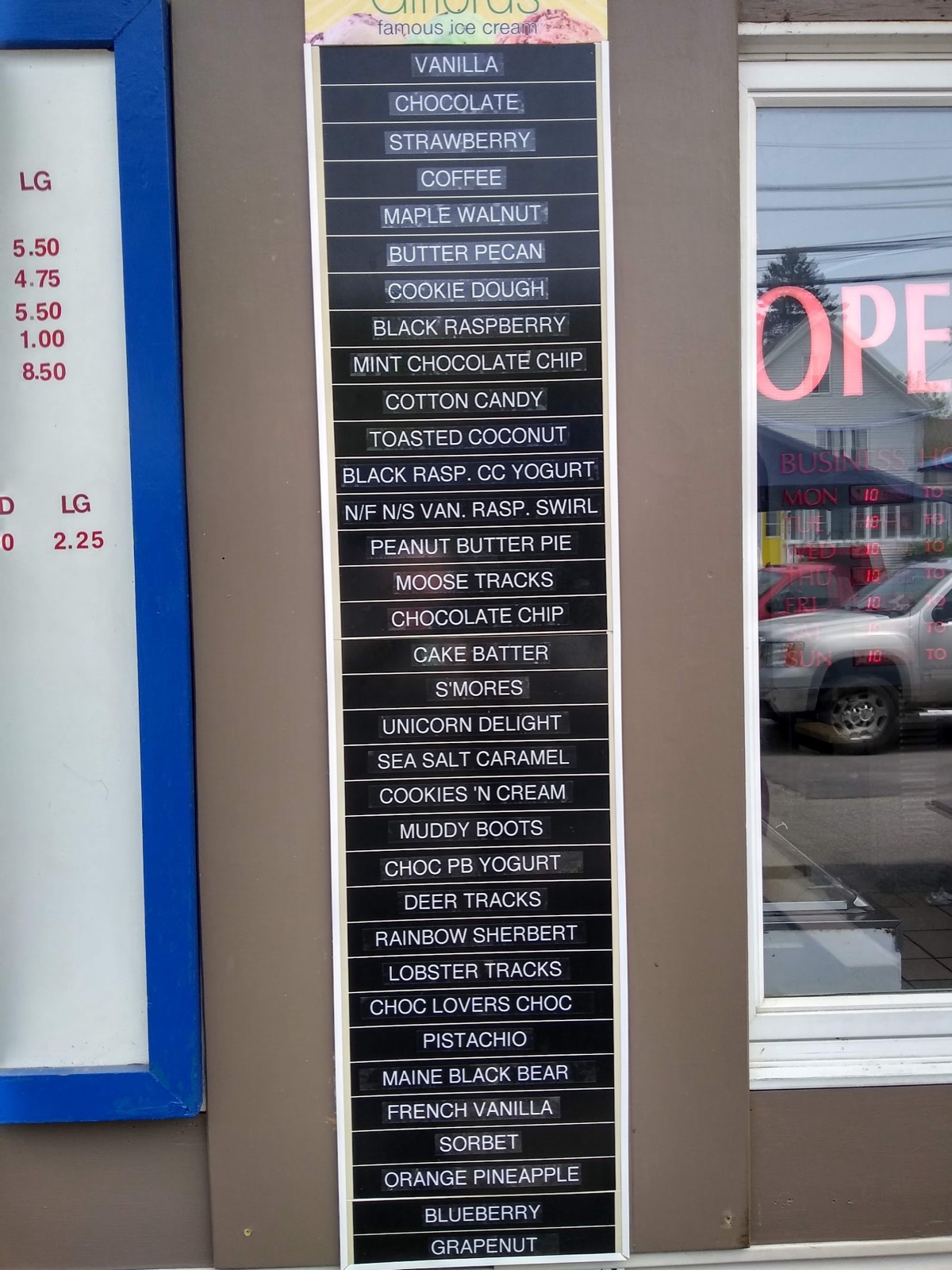 The shop's ice cream flavor board, a tall list of flavor names in white on black.